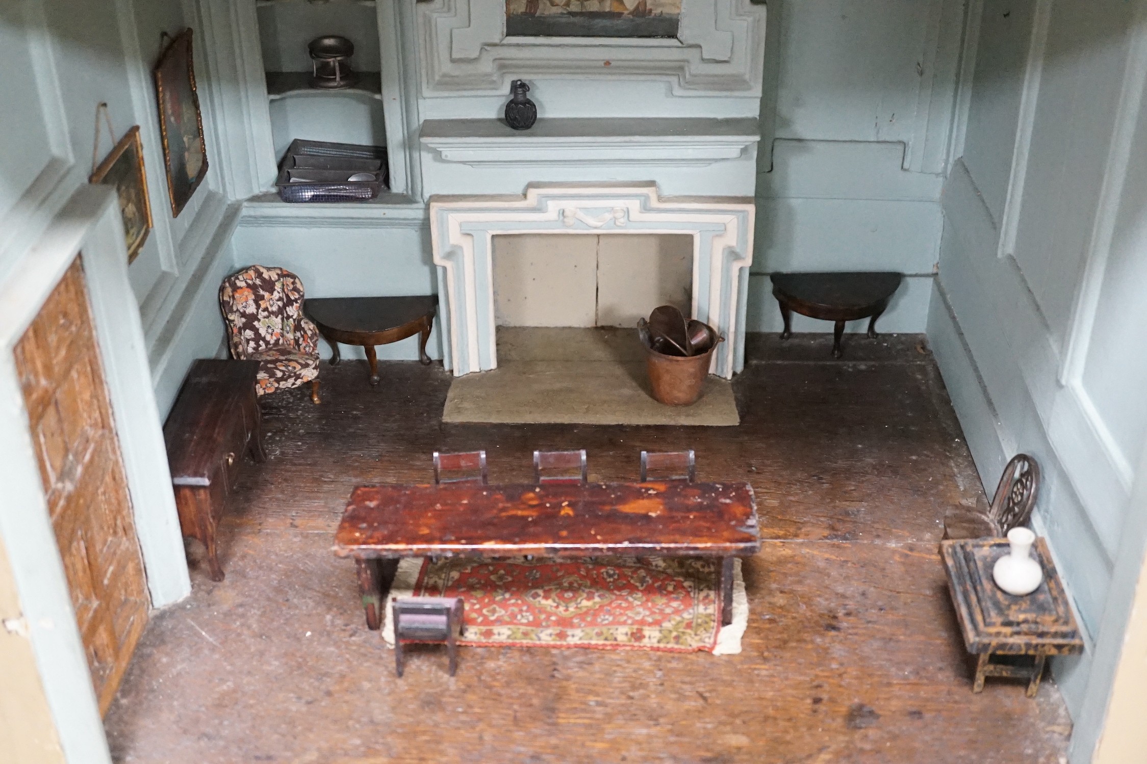 An early 19th century painted doll's house with block work facade enclosing a four room interior with central staircase, to be sold with assorted later furniture and accessories, width 117cm, depth 48cm, height with asso